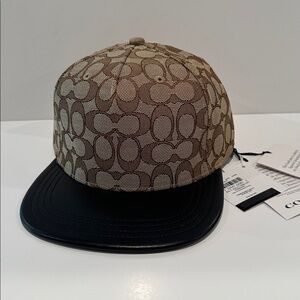 NWT Coach Men’s Monogram Canvas & Leather Cap with Leather adjustable back.